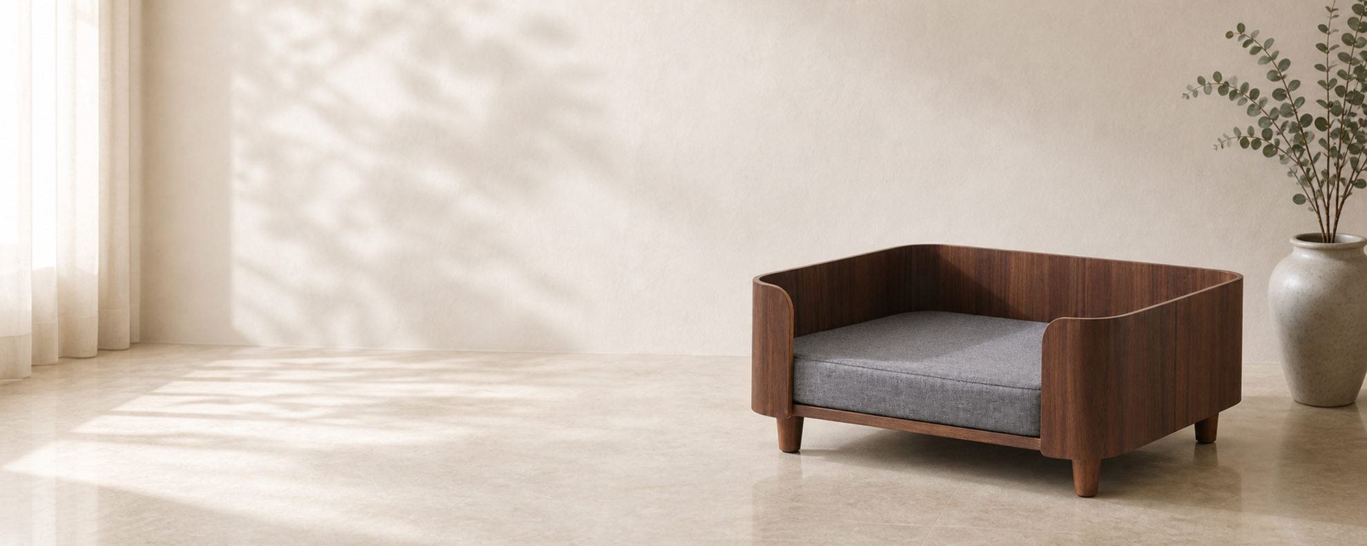A walnut Faunora pet bed with a soft bouclé cushion in a serene interior