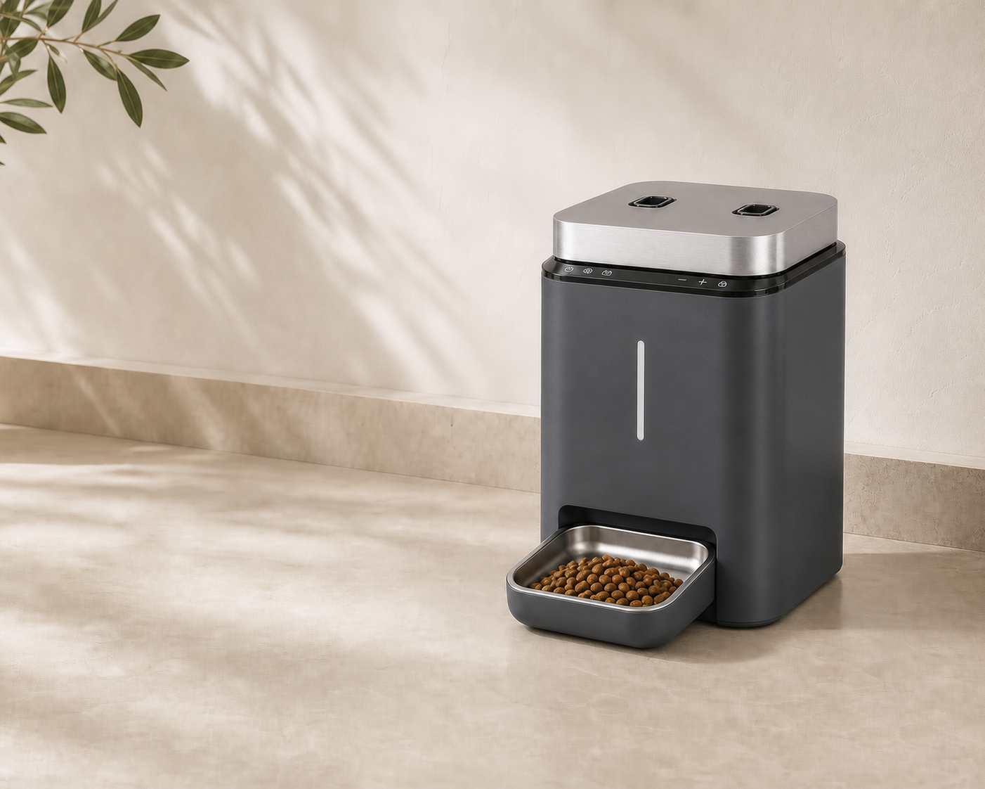 Matte black Faunora automatic feeder on a warm stone bench